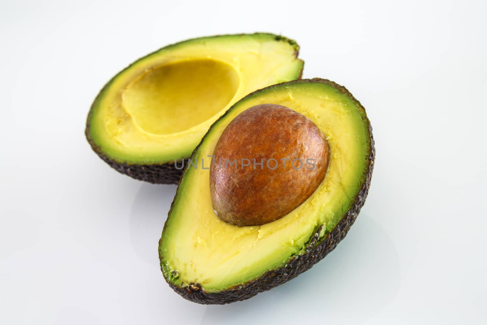 Fresh avocado on white background. Selective focus by pixinoo