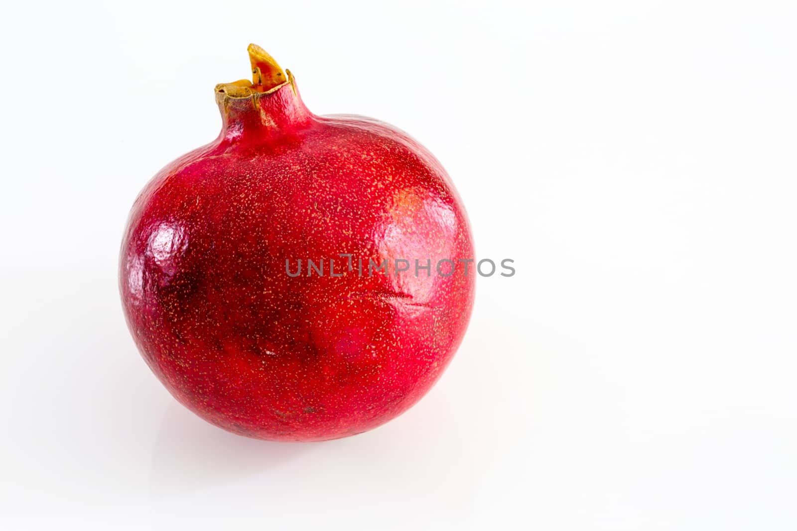 pomegranate fruit on a white background by pixinoo