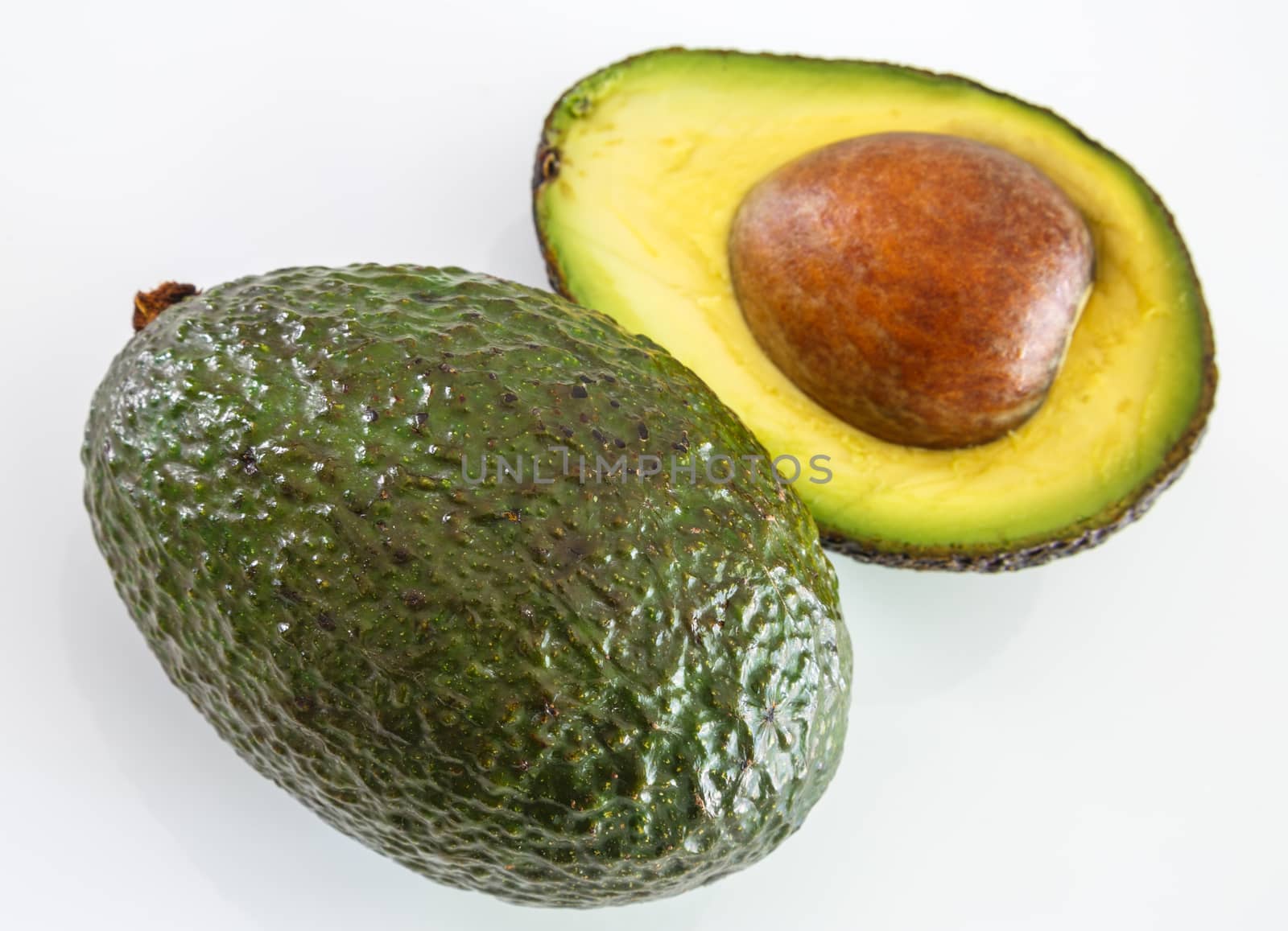 Fresh avocado on white background. Selective focus by pixinoo