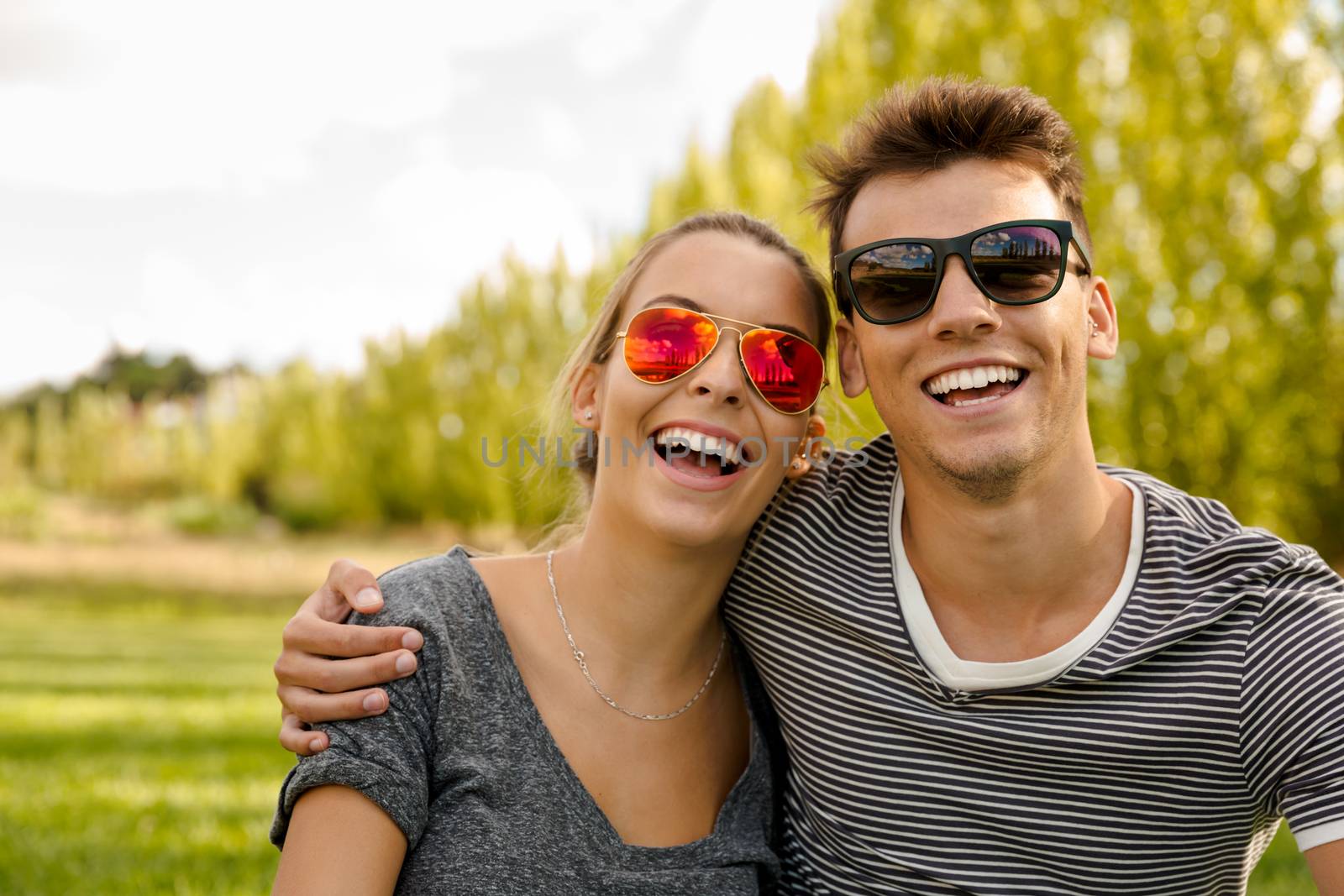 Portrait of a happy young couple embraced