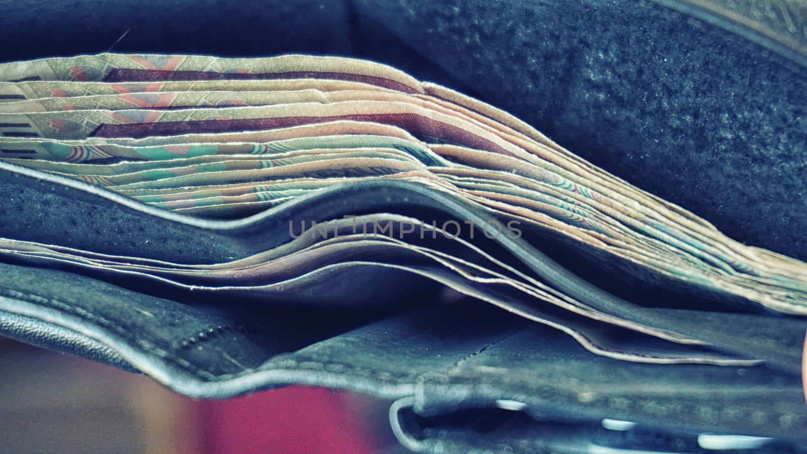 A look at a purse with paper money.