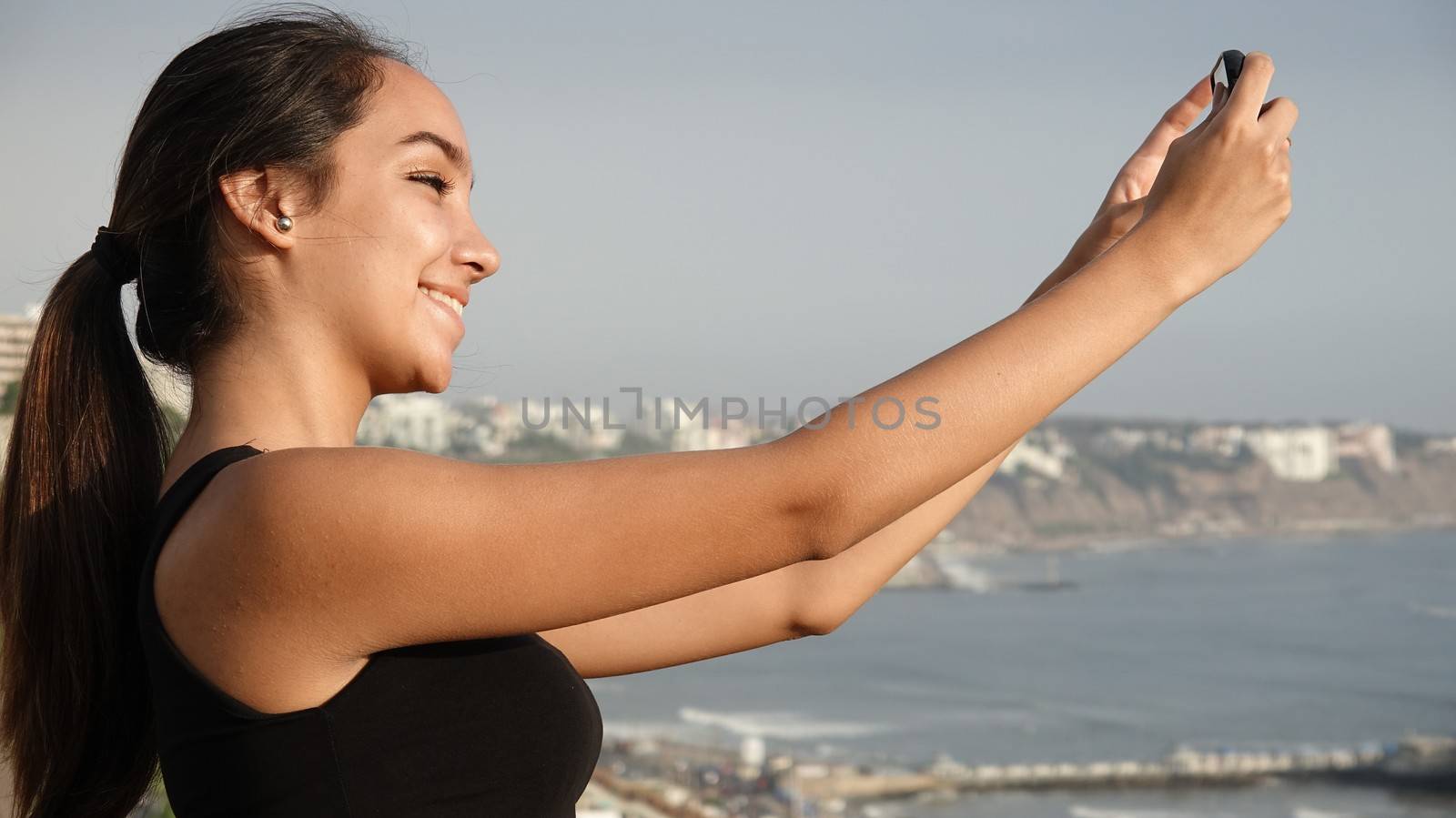 Teen Girl Taking Photo by dtiberio