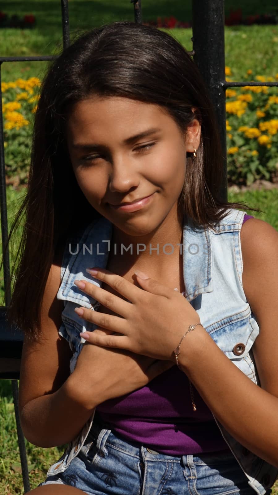 Teen Girl Hands Over Heart