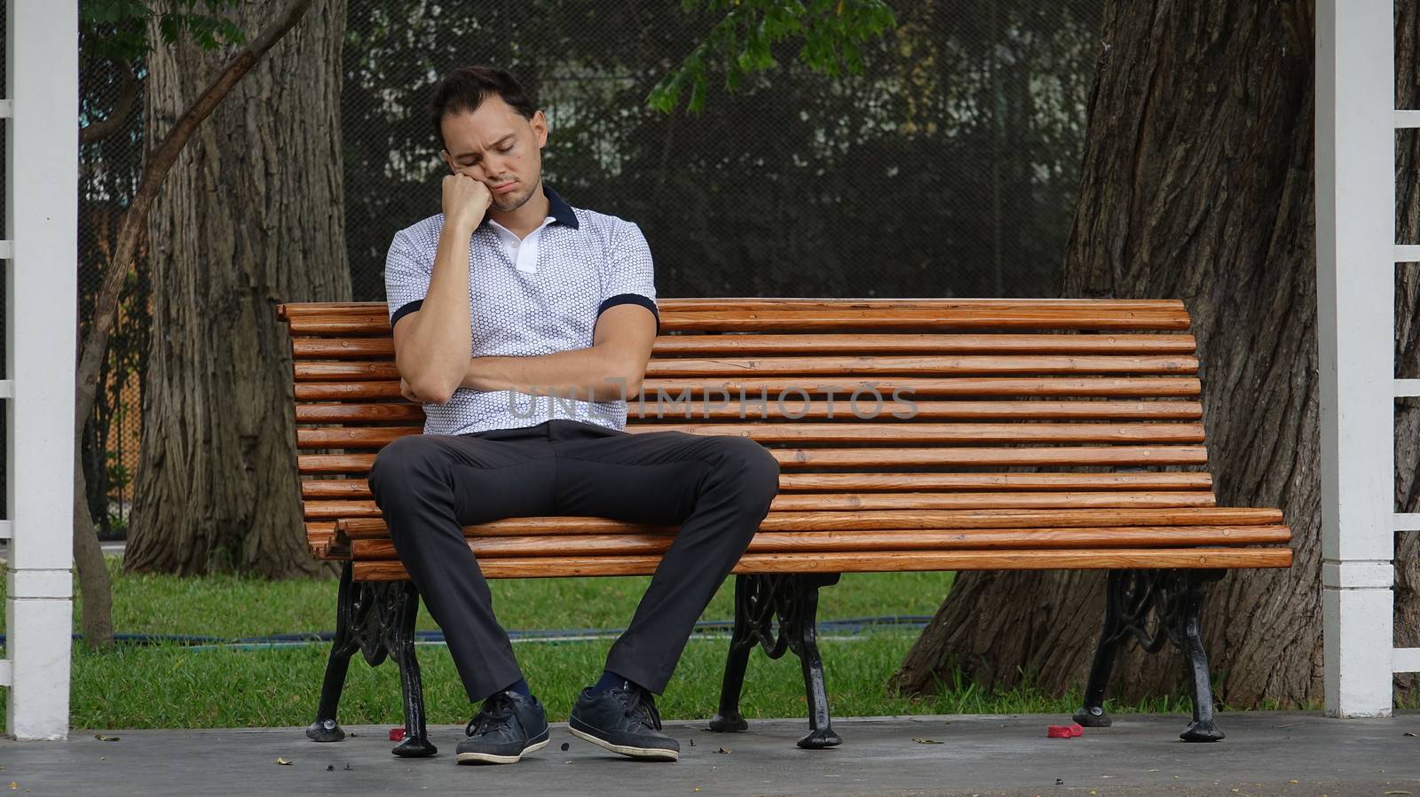 Sad Or Tired Man Alone On Bench by dtiberio