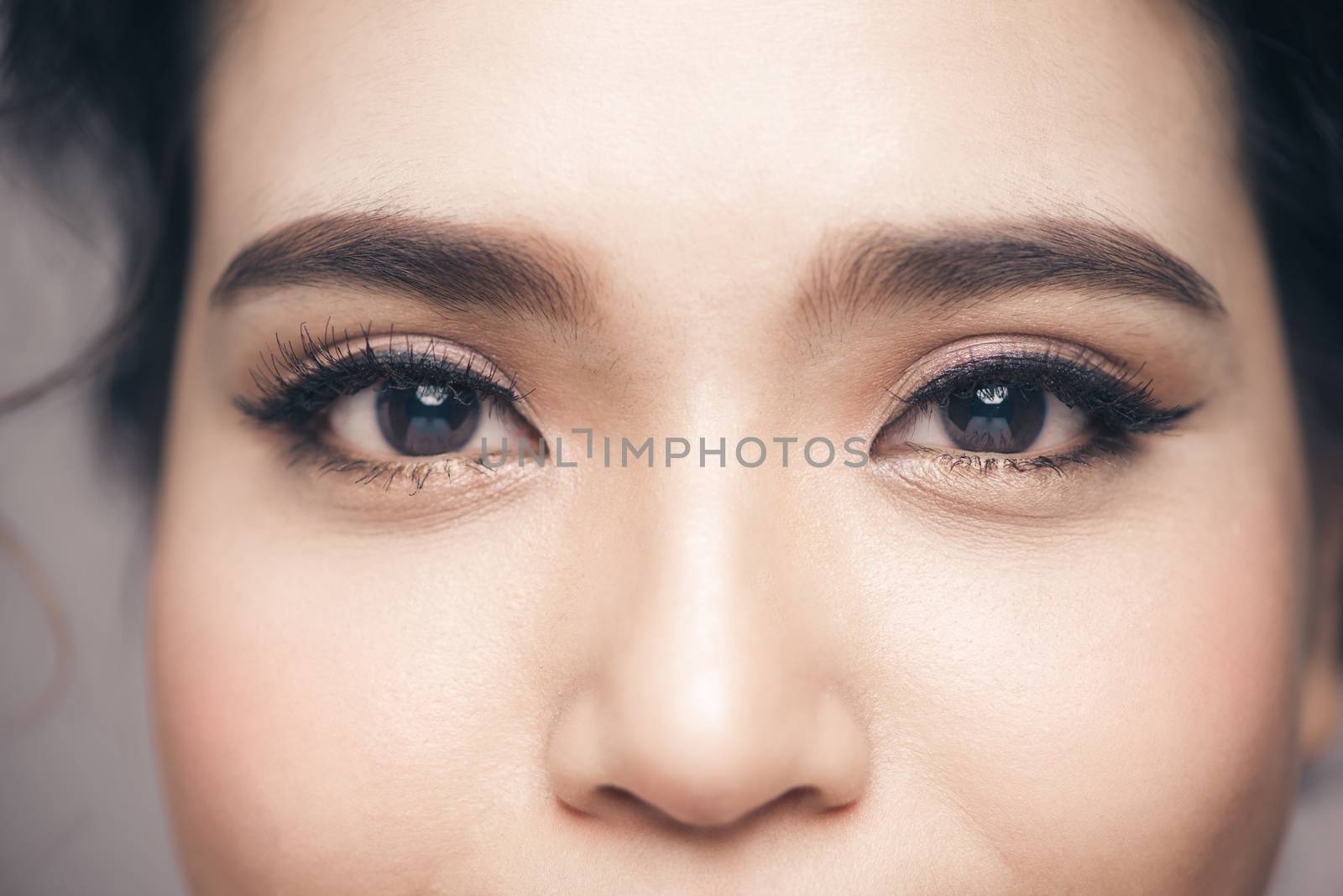 Asian model eye close-up with long eyelashes. Selective focus by makidotvn
