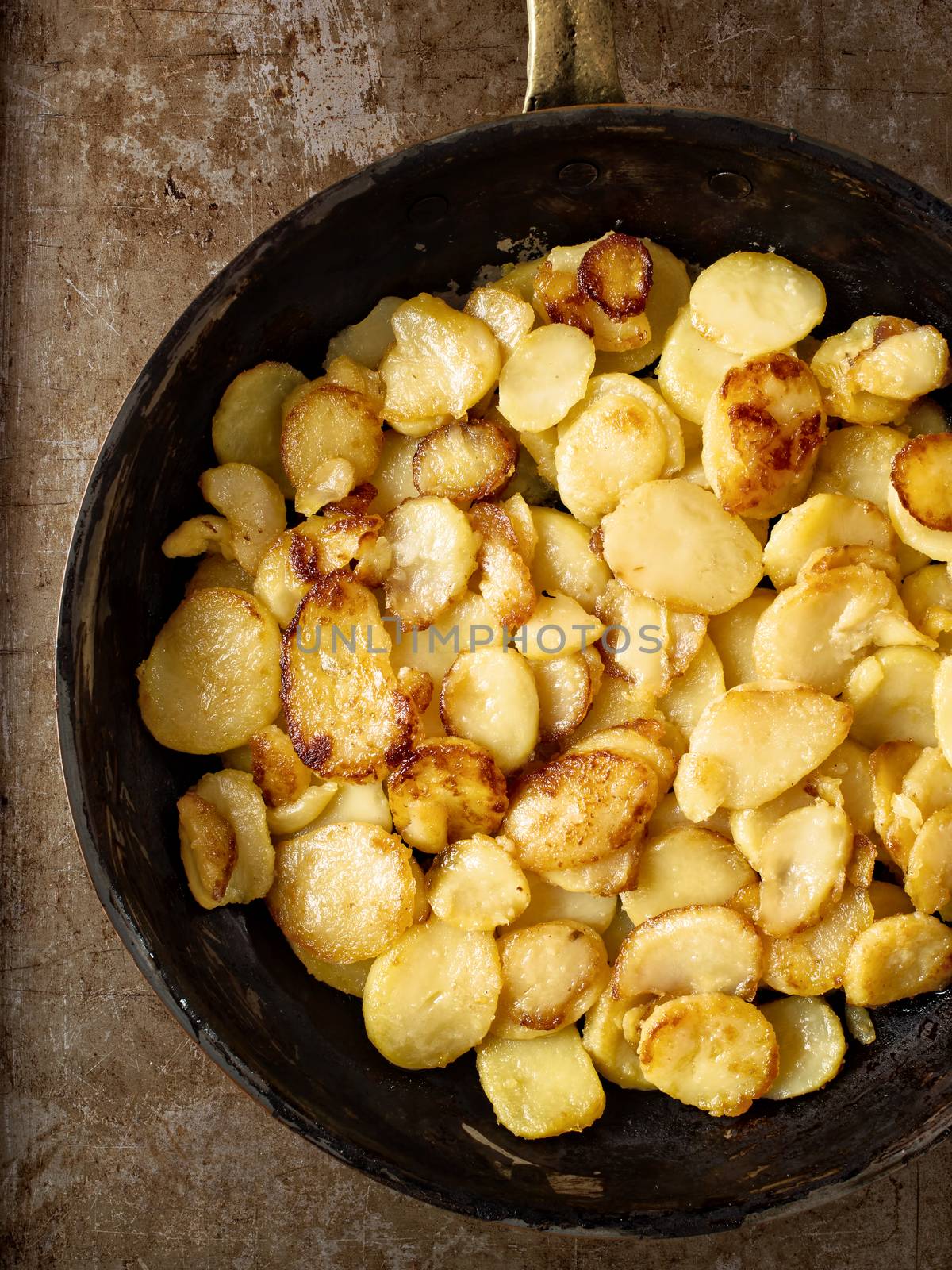 close up of rustic golden german pan fried potato bratkartofflen