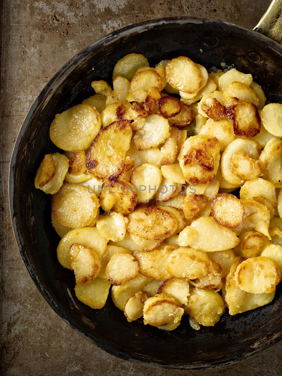 close up of rustic golden german pan fried potato bratkartofflen