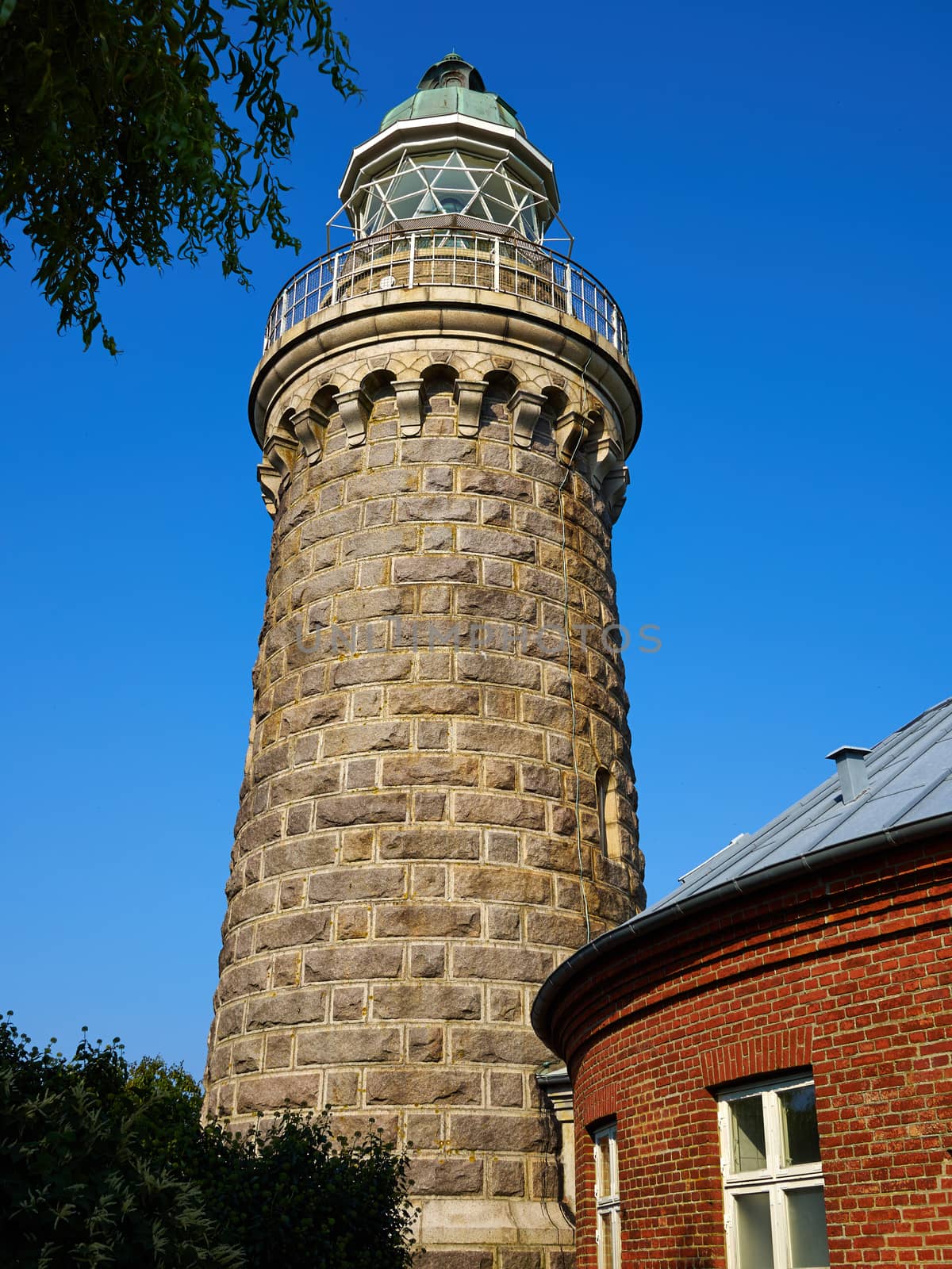 Old stone traditional lighthouse on the beach the island of Aeroe Denmark