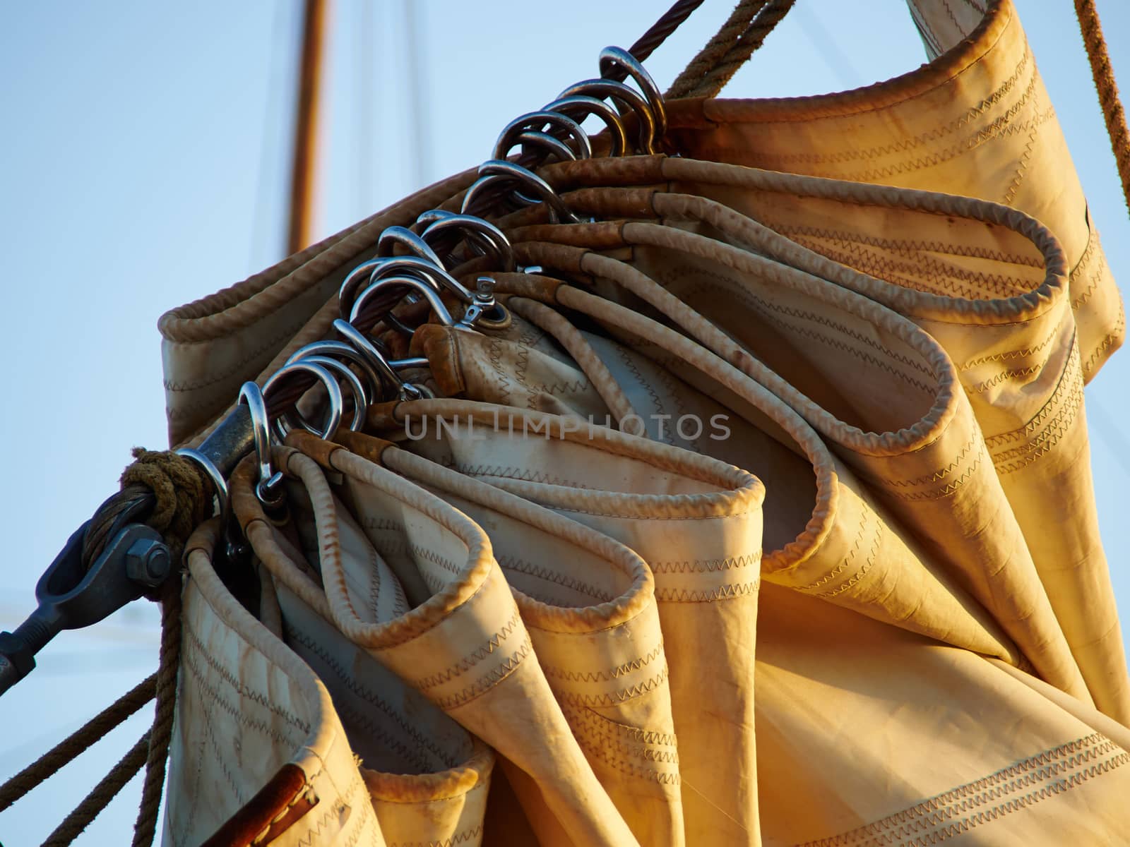 Details of gathered sail of a large classical traditional vintage tall sailing ship