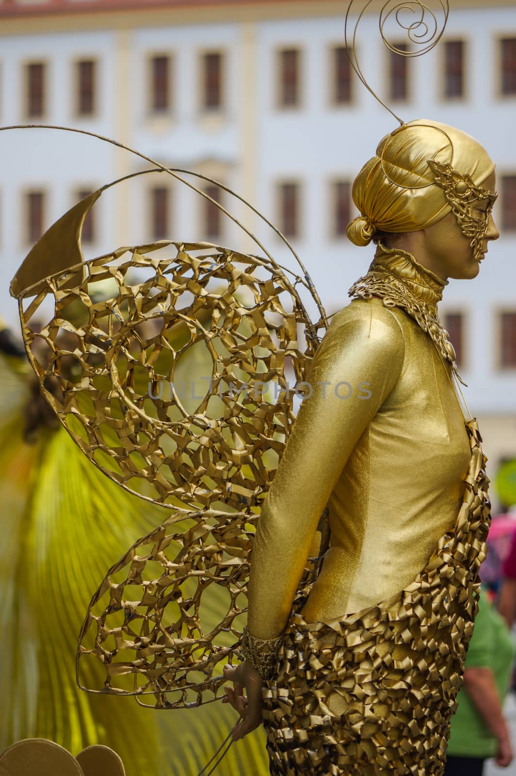 DRESDEN, GERMANY - JULY 13, 2015: a performer - Golden painted artists on a city street, living statues