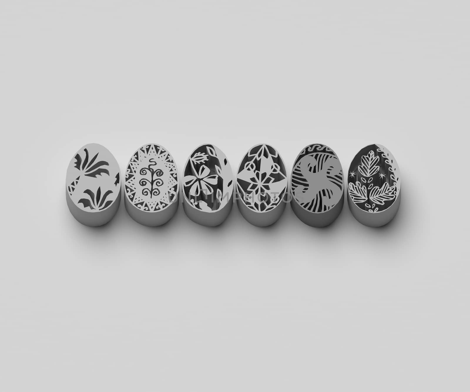 BLACK AND WHITE PHOTO OF 3D EXTRUDED EASTER EGGS ON PLAIN BACKGROUND