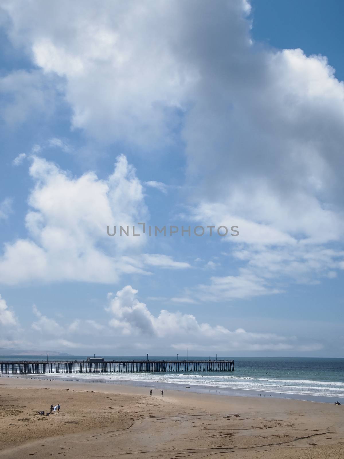 Image of wooden jetty with ocean and sky in background