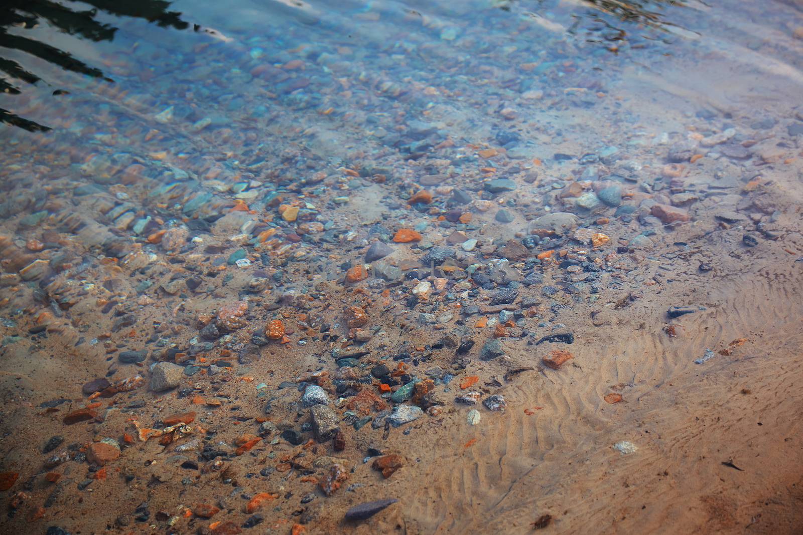 Underwater pebbles in the river. Close-up photo
