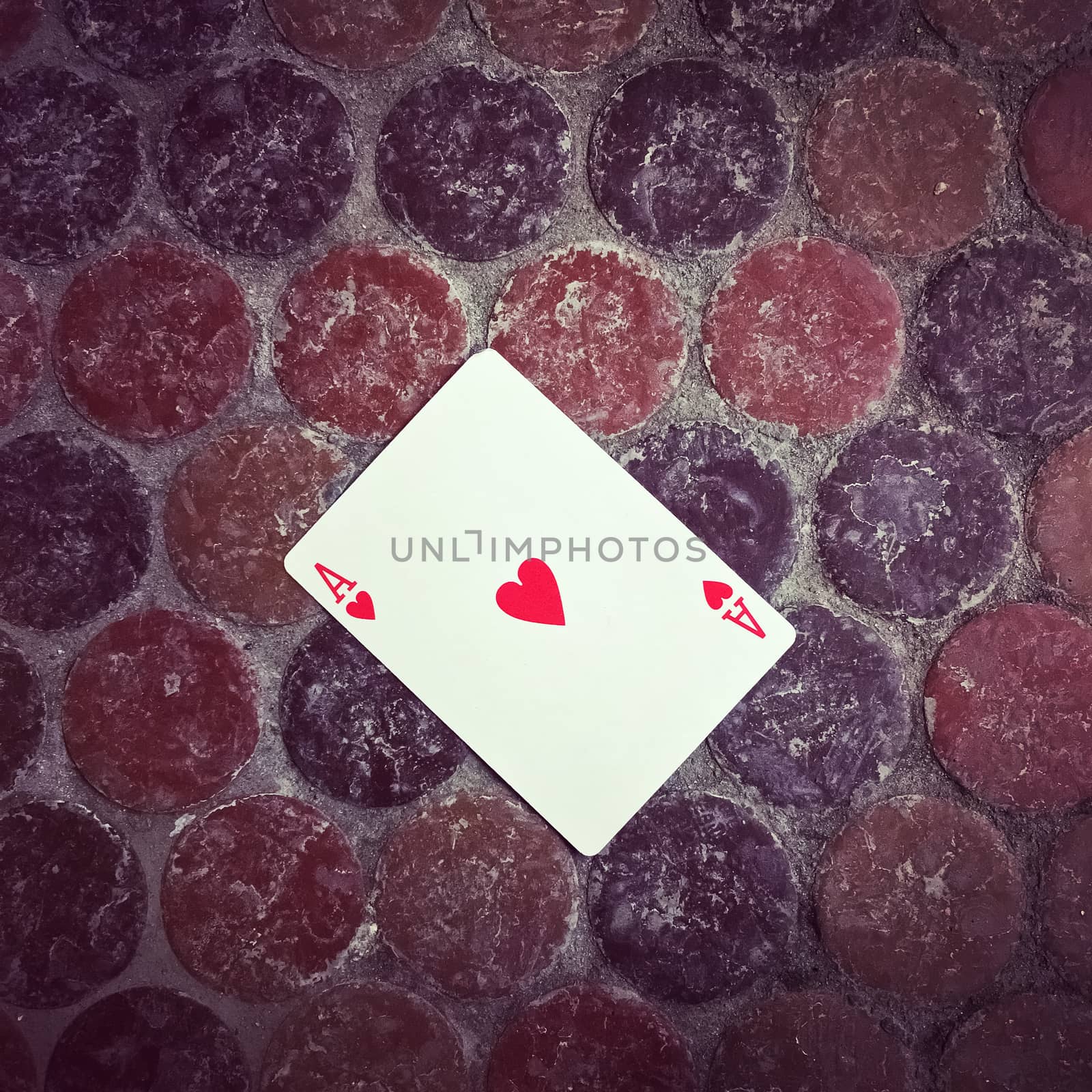 Ace of hearts card on the floor. Good luck concept.