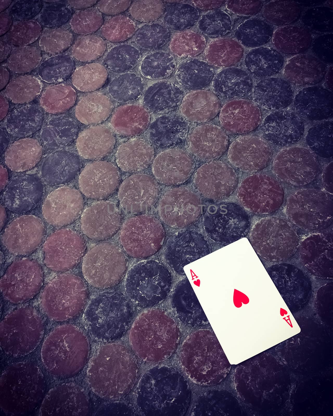 Ace of hearts card on the dirty floor by anikasalsera