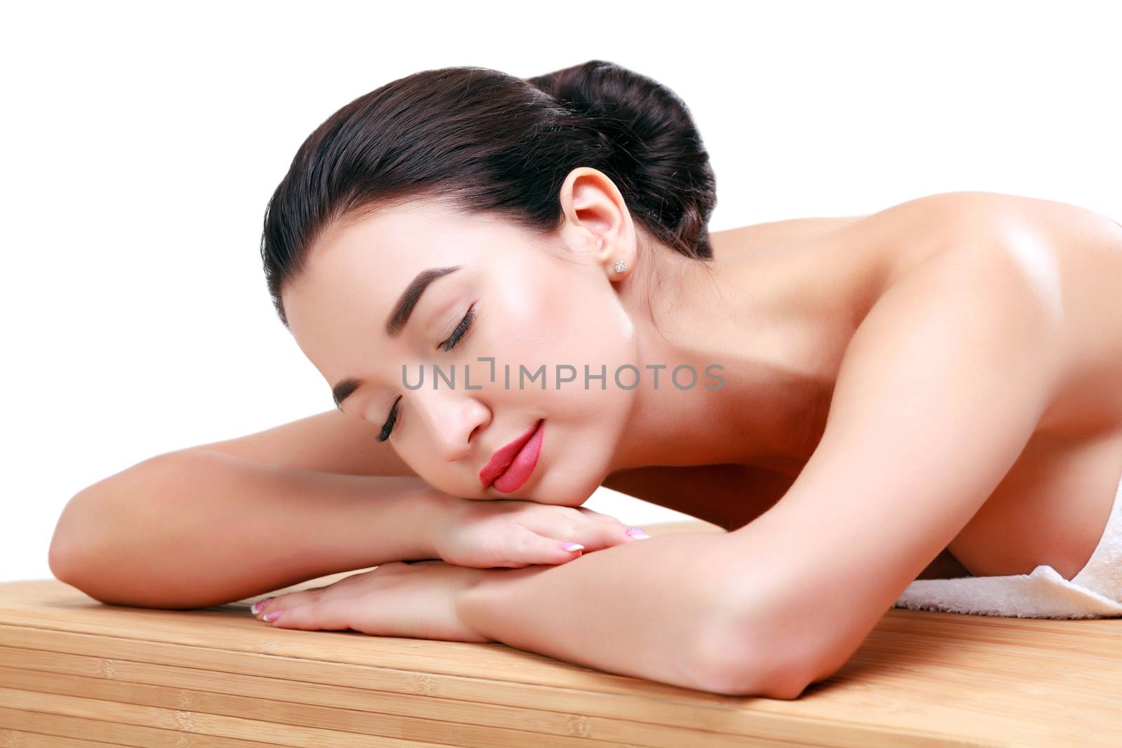 Young beautiful asian woman relaxing at spa salon, isolated on white background