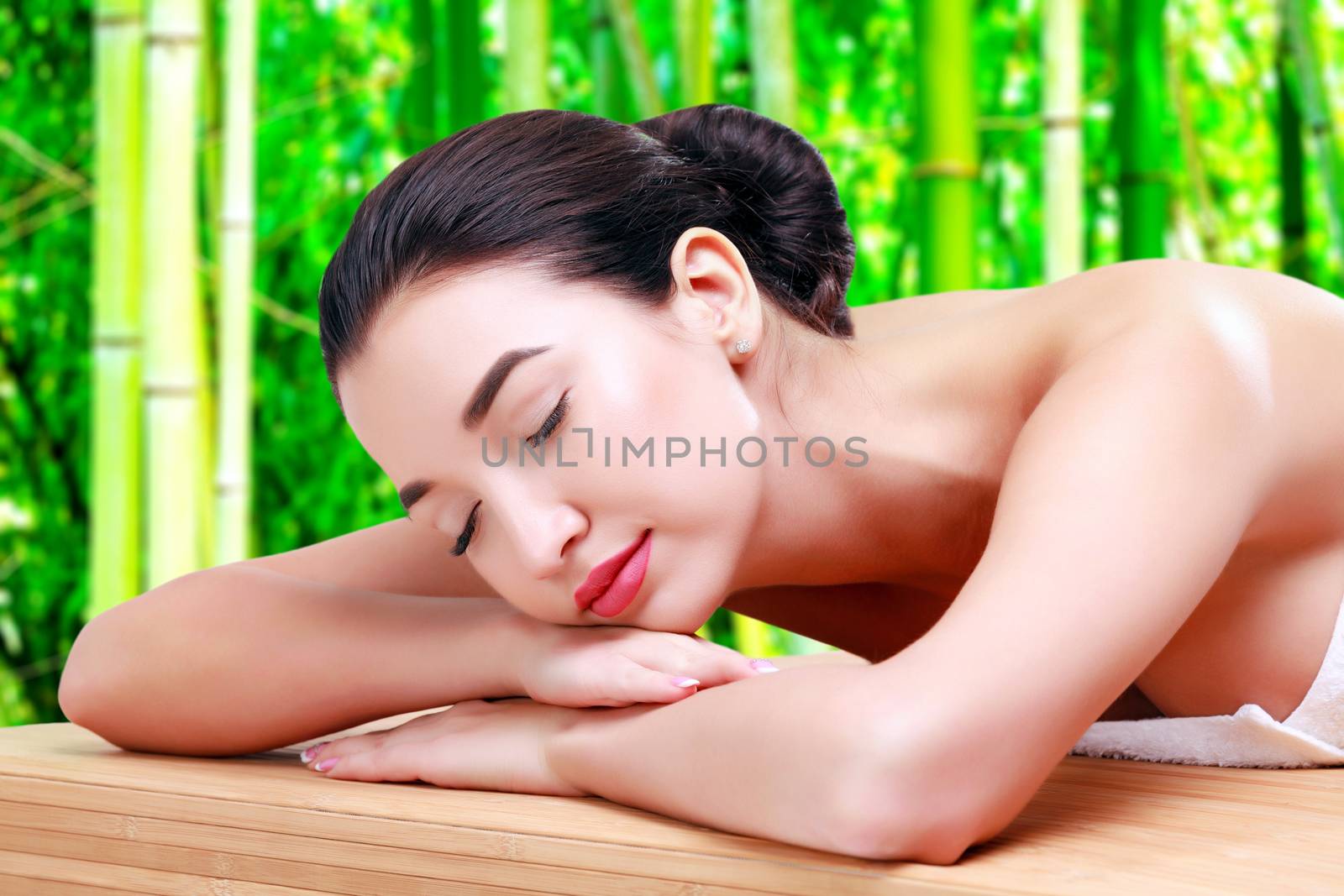 Young beautiful asian woman relaxing at spa salon in bamboo forest, isolated on white background