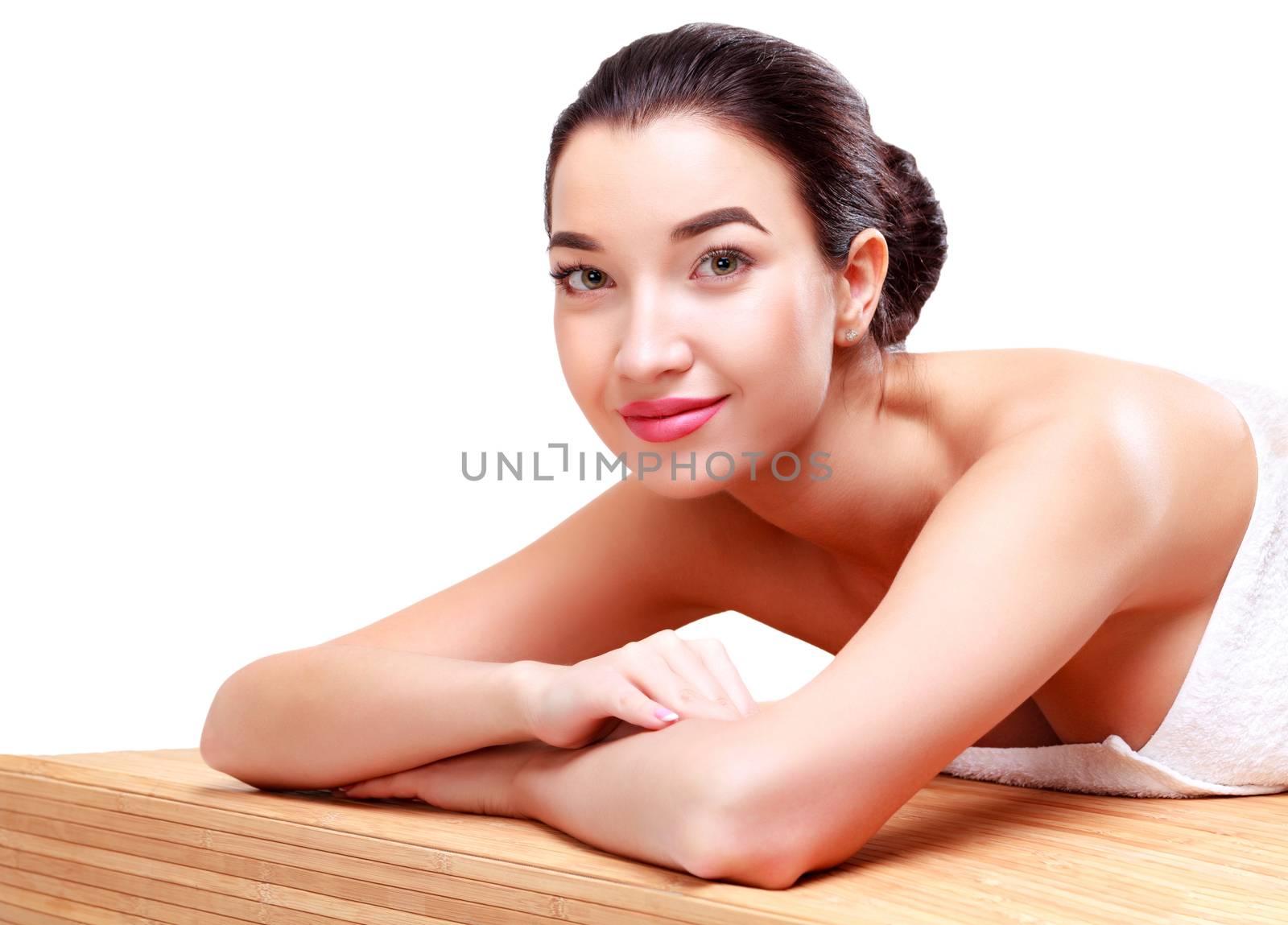 Young beautiful asian woman relaxing at spa salon, isolated on white background