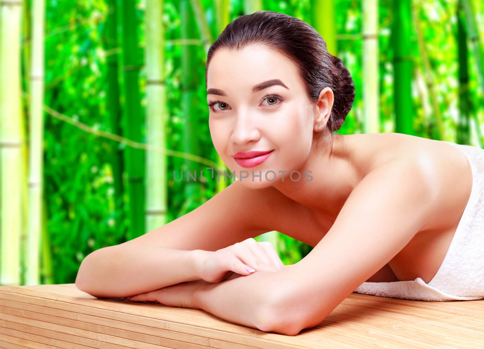 Young beautiful asian woman relaxing at spa salon in bamboo forest