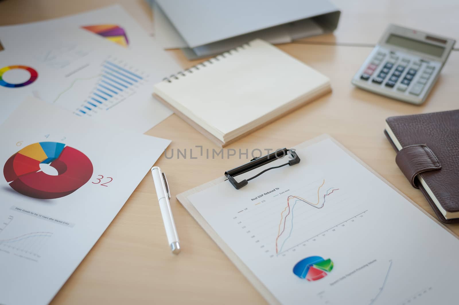 Business documents on table in office. Working analysis using graphs abd charts.