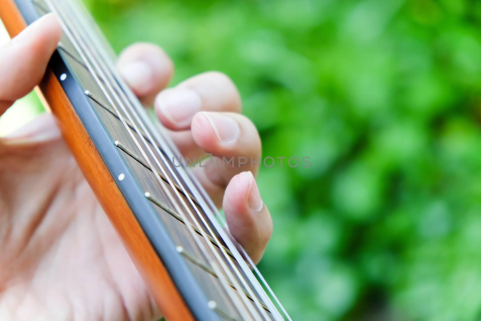 close up of playing guitar background