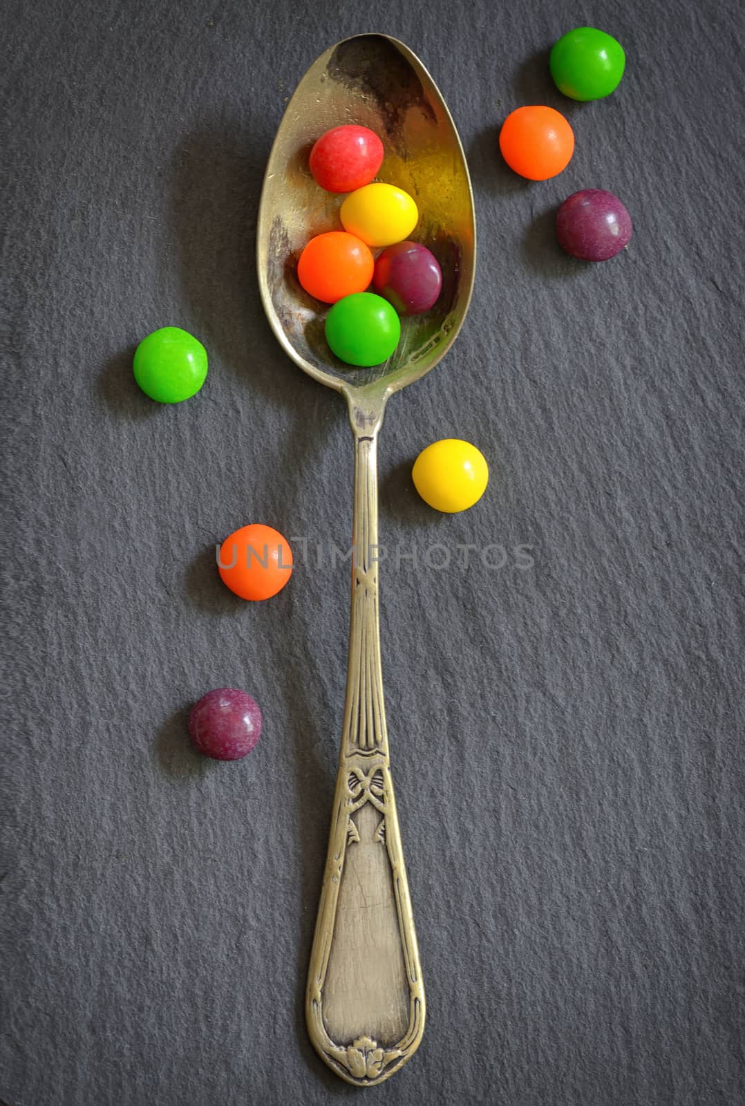Colorful jelly candies in spoon  by mady70