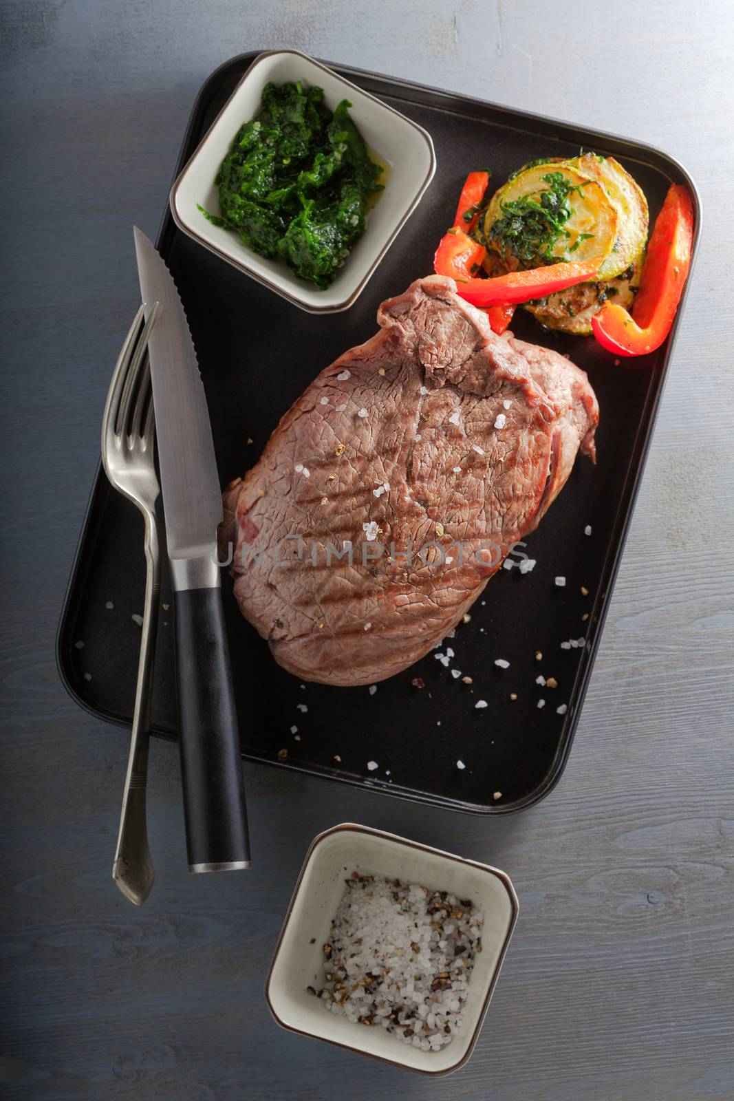 Roast Beef dinner with roasted zucchini, pepper and salsa verde