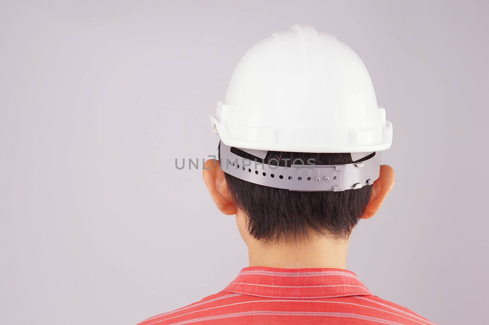 Engineer wear red shirt and white engineer hat turn back by eaglesky