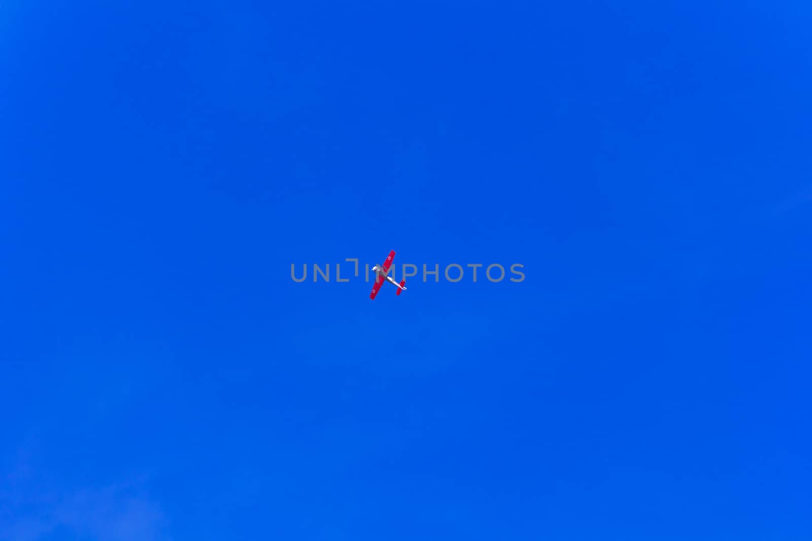 Photo of flying military airplane in blue sky