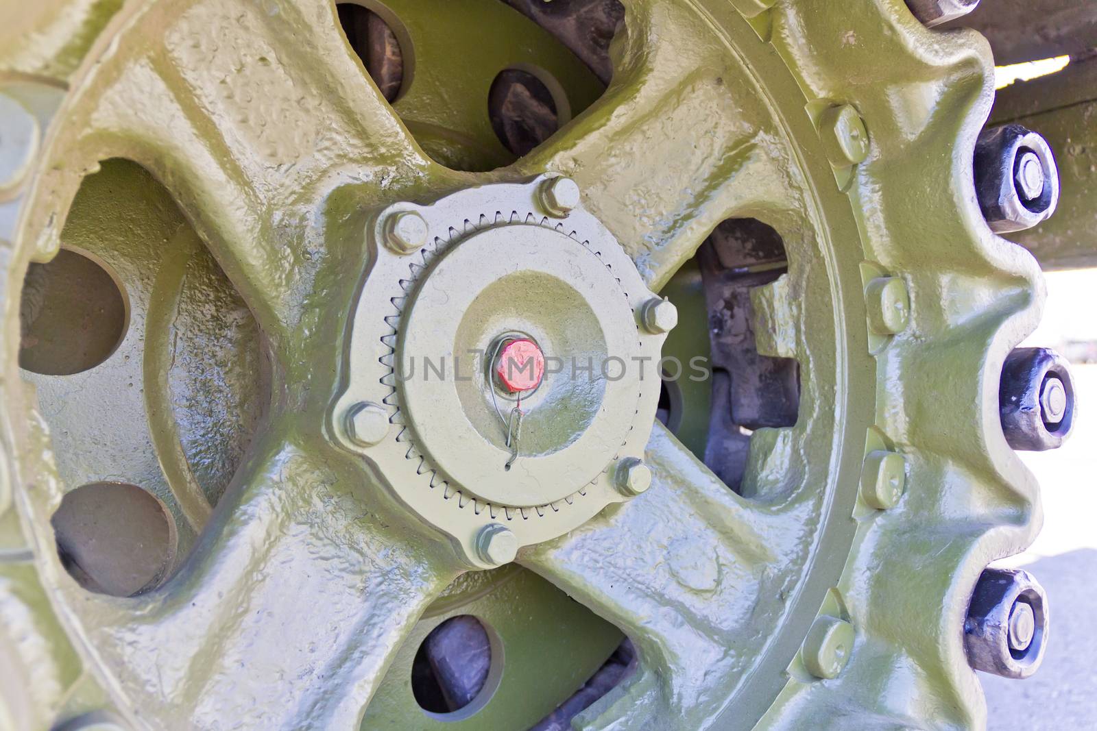 Caterpillar wheel of military machine at the exhibition under open sky