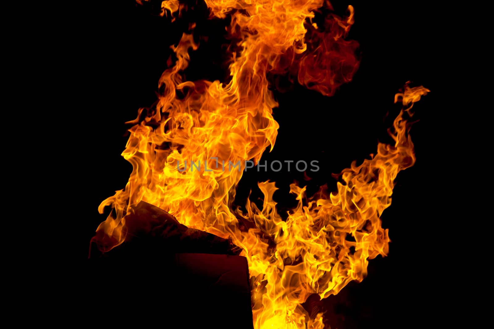 Photo of red fire flame on black background