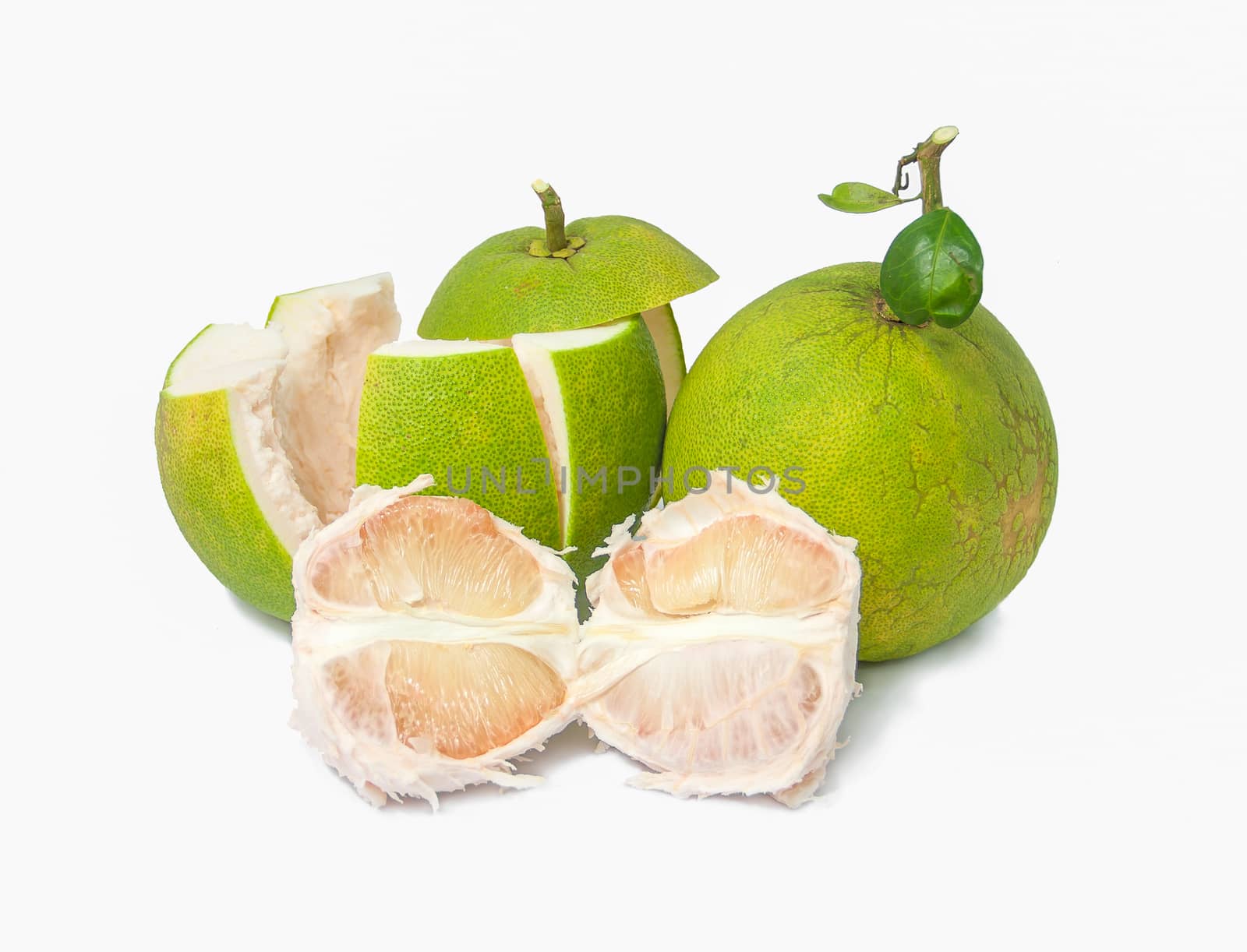 green pomelo fruits on white background