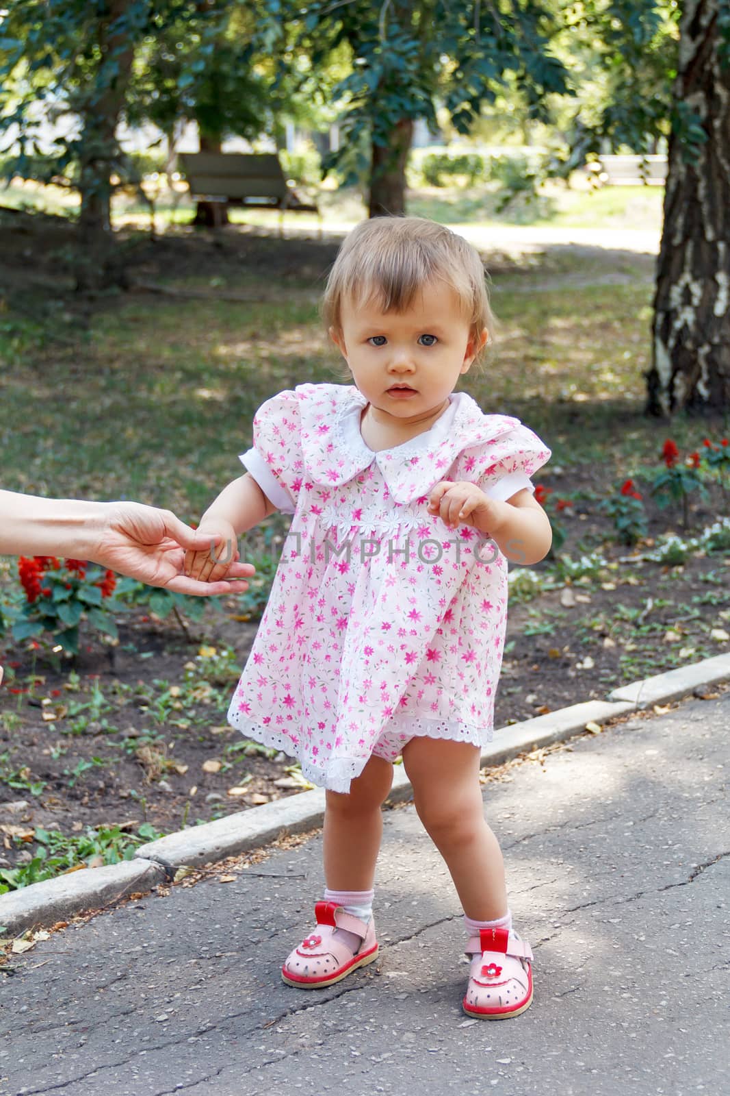 Cute Caucasian girl with short hair walking in summer