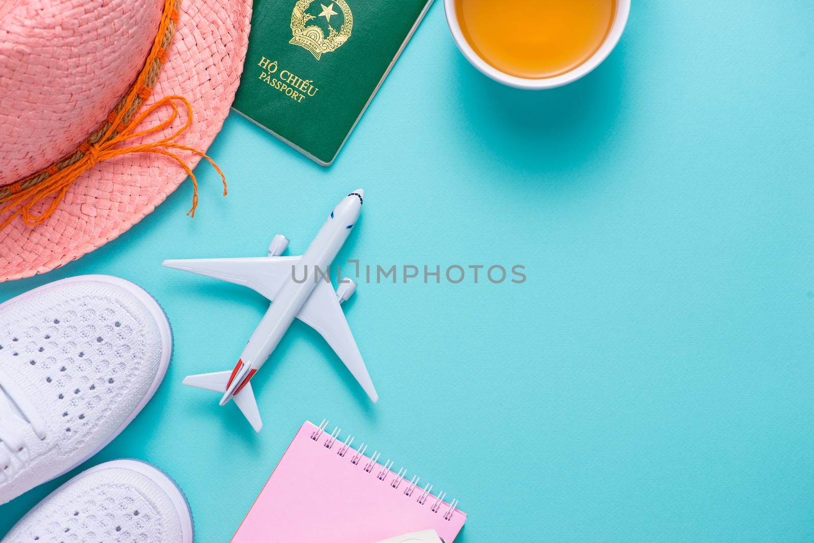 Vacation concept. Top view of travel accessories set on wooden background with copy space