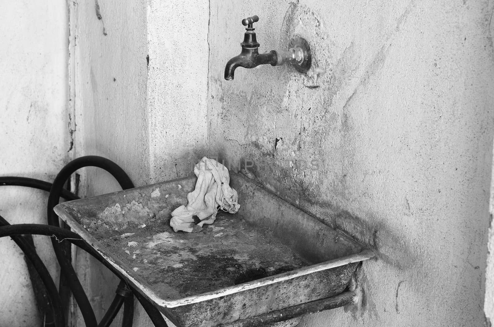 Old dirty metal rusty sink black and white theme