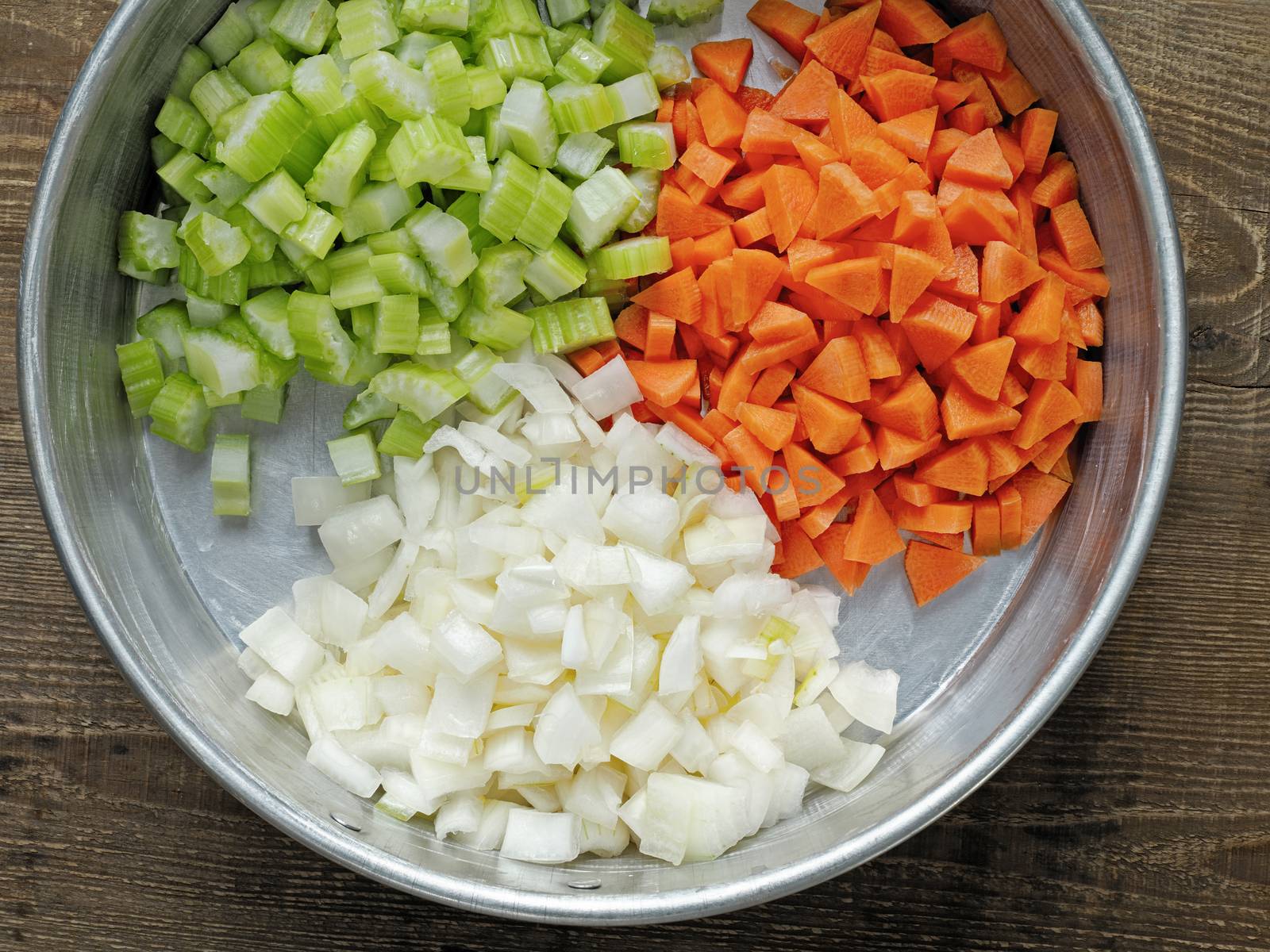 close up of rustic diced carrot onion and celery
