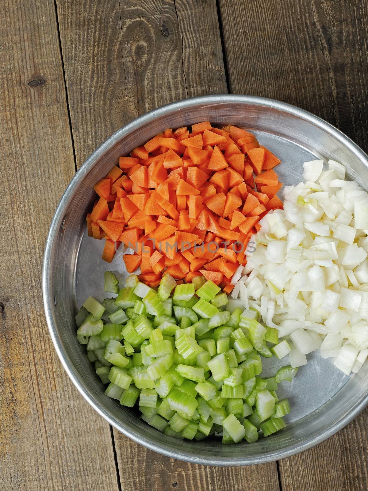 close up of rustic diced carrot onion and celery