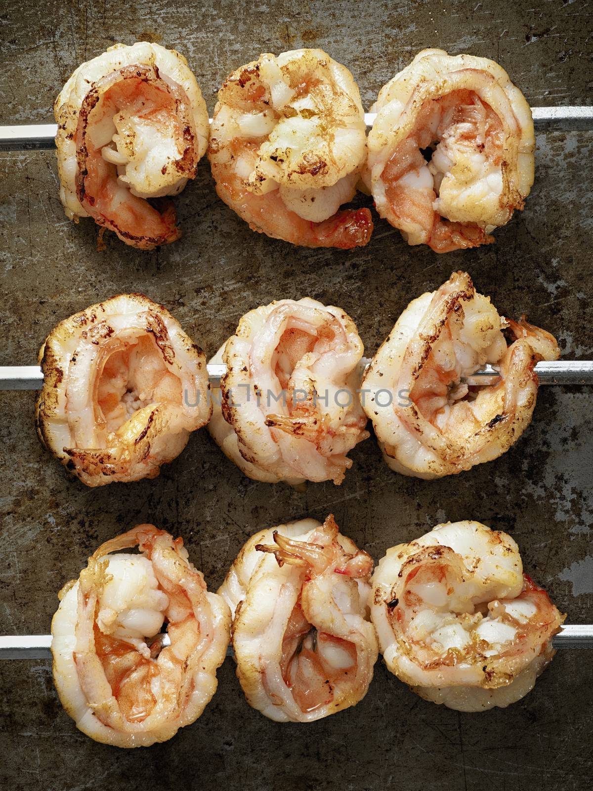 closed up of rustic grilled shrimp skewer