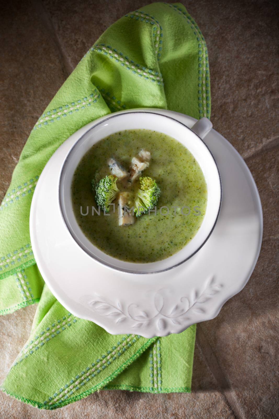A bowl of creamy broccoli soup with blue cheese


