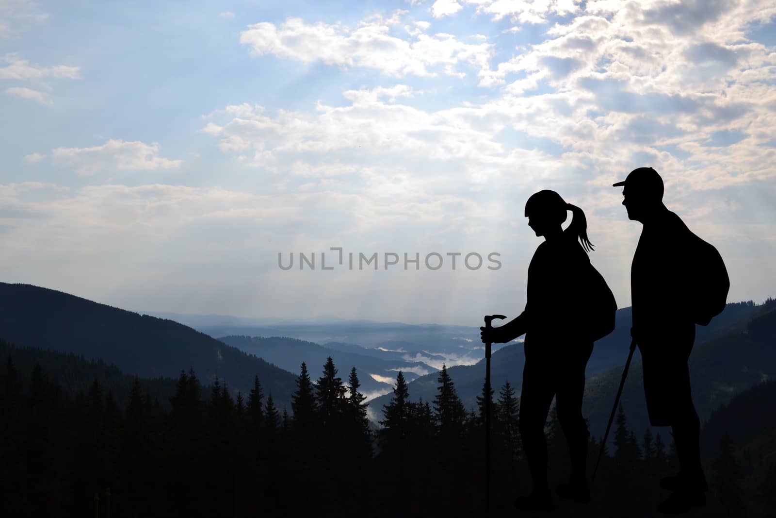 Couple of tourists enjoying valley view from top of a mountain by hibrida13