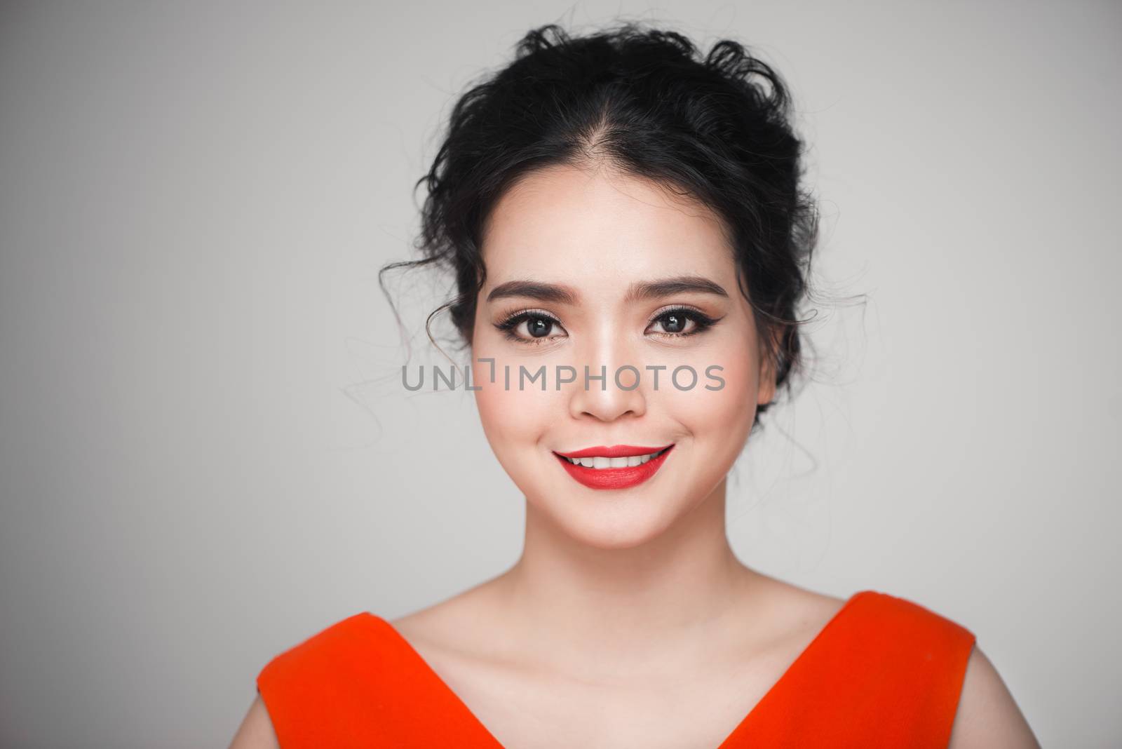 Fashion portrait of asian woman with elegant hairstyle. Perfect makeup.