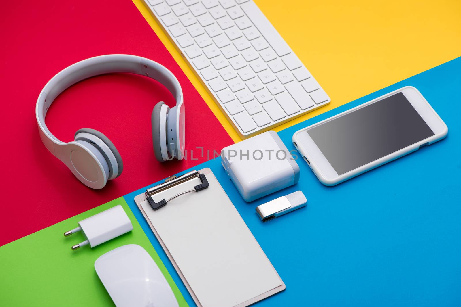 Well organised white office objects on colorful background by makidotvn