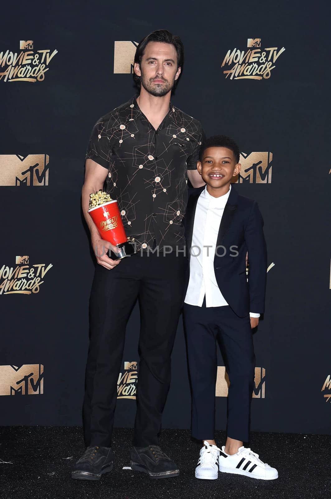 Milo Ventimiglia, Lonnie Chavis at the 2017 MTV Movie & TV Awards, Press Room, Shrine Auditorium, Los Angeles, CA 05-07-17