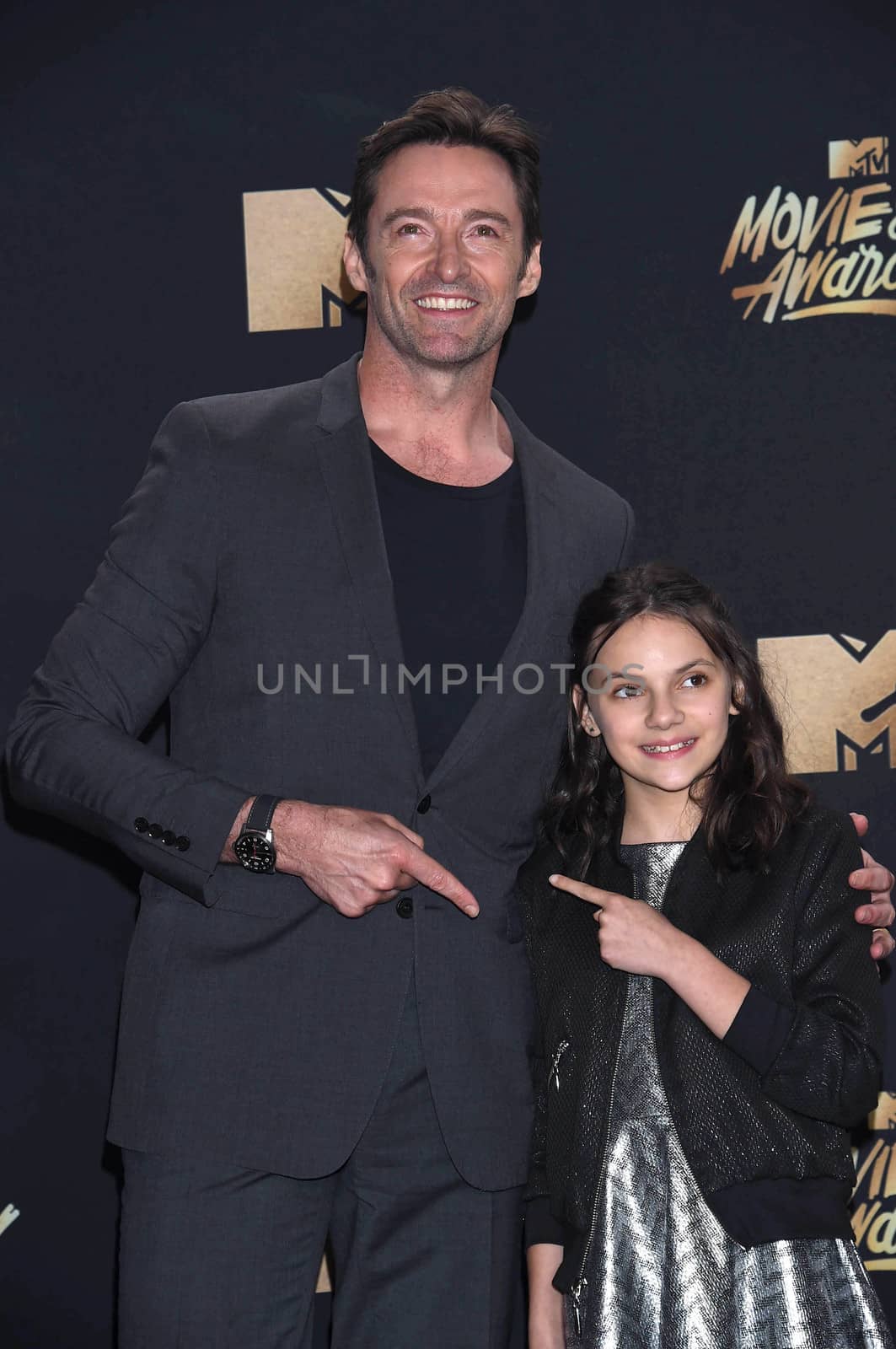 Hugh Jackman, Dafne Keen at the 2017 MTV Movie & TV Awards, Press Room, Shrine Auditorium, Los Angeles, CA 05-07-17
