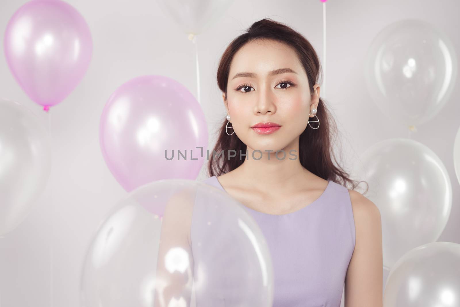 Asian pretty fashionable woman with pastel balloons by makidotvn
