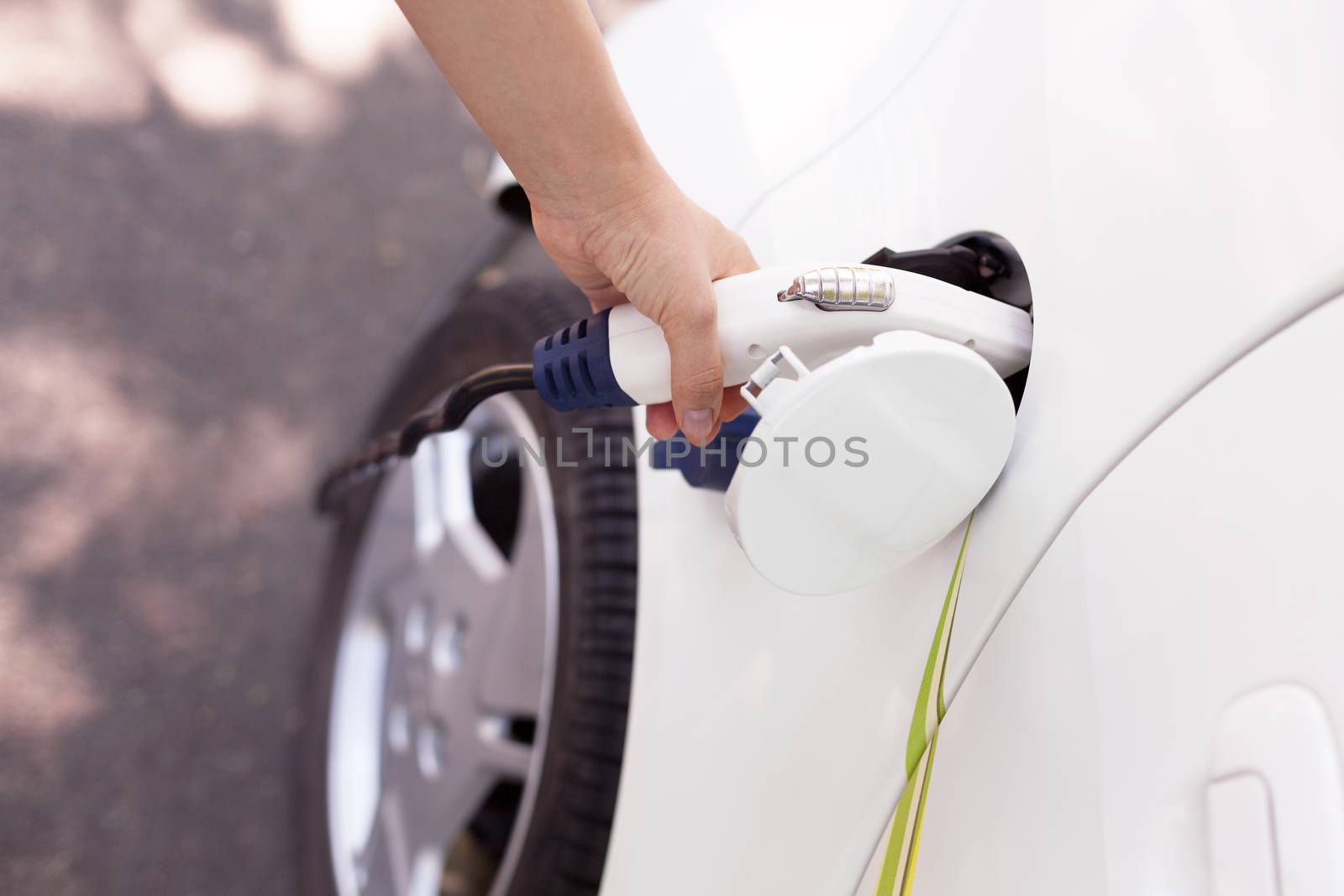 Charging battery of an electric car by wellphoto