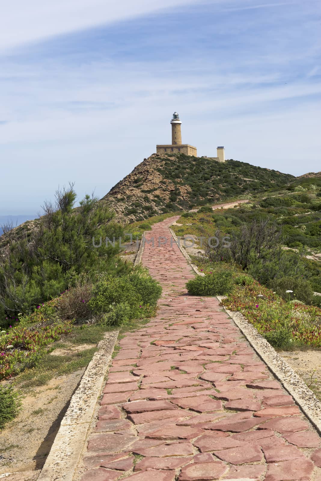 Capo Sandalo Lighthouse on the Westernmost point os St Pietro Island. Southwestern corner of Sardinia, Italy