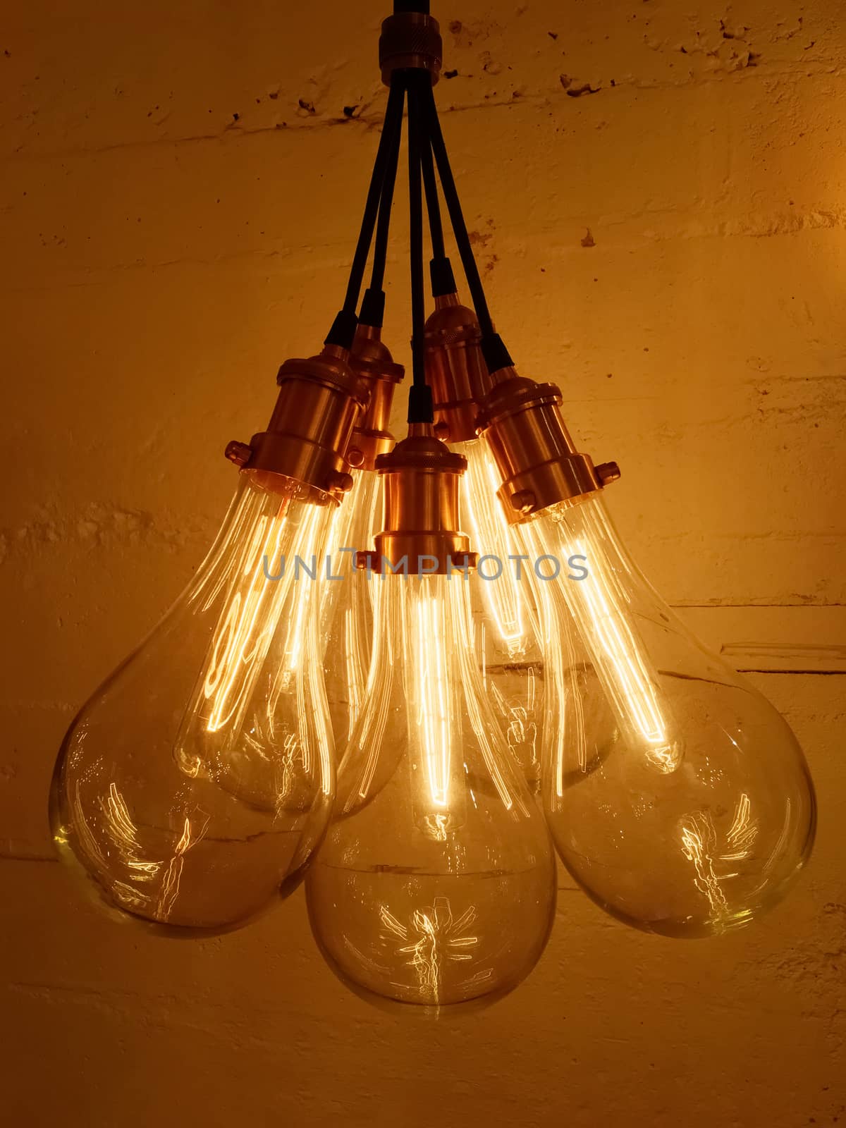 Bunch of light bulbs on concrete background. Modern design with retro feel.