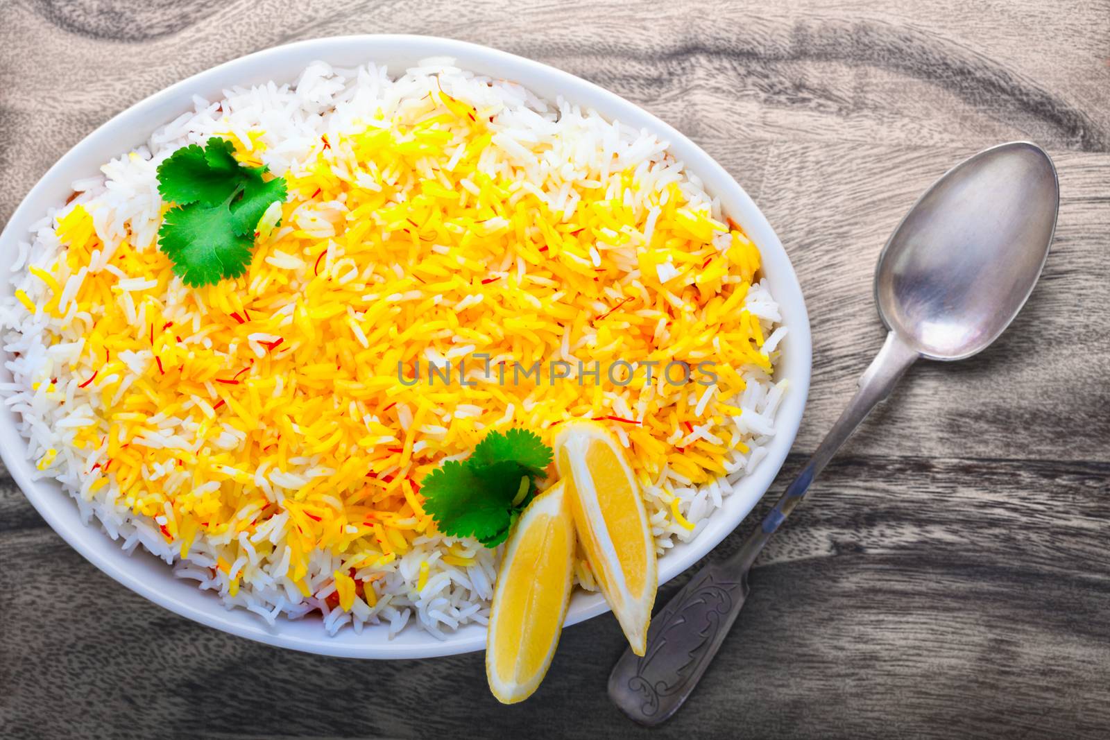 Indian Biryani with Shrimp and lemon on a table