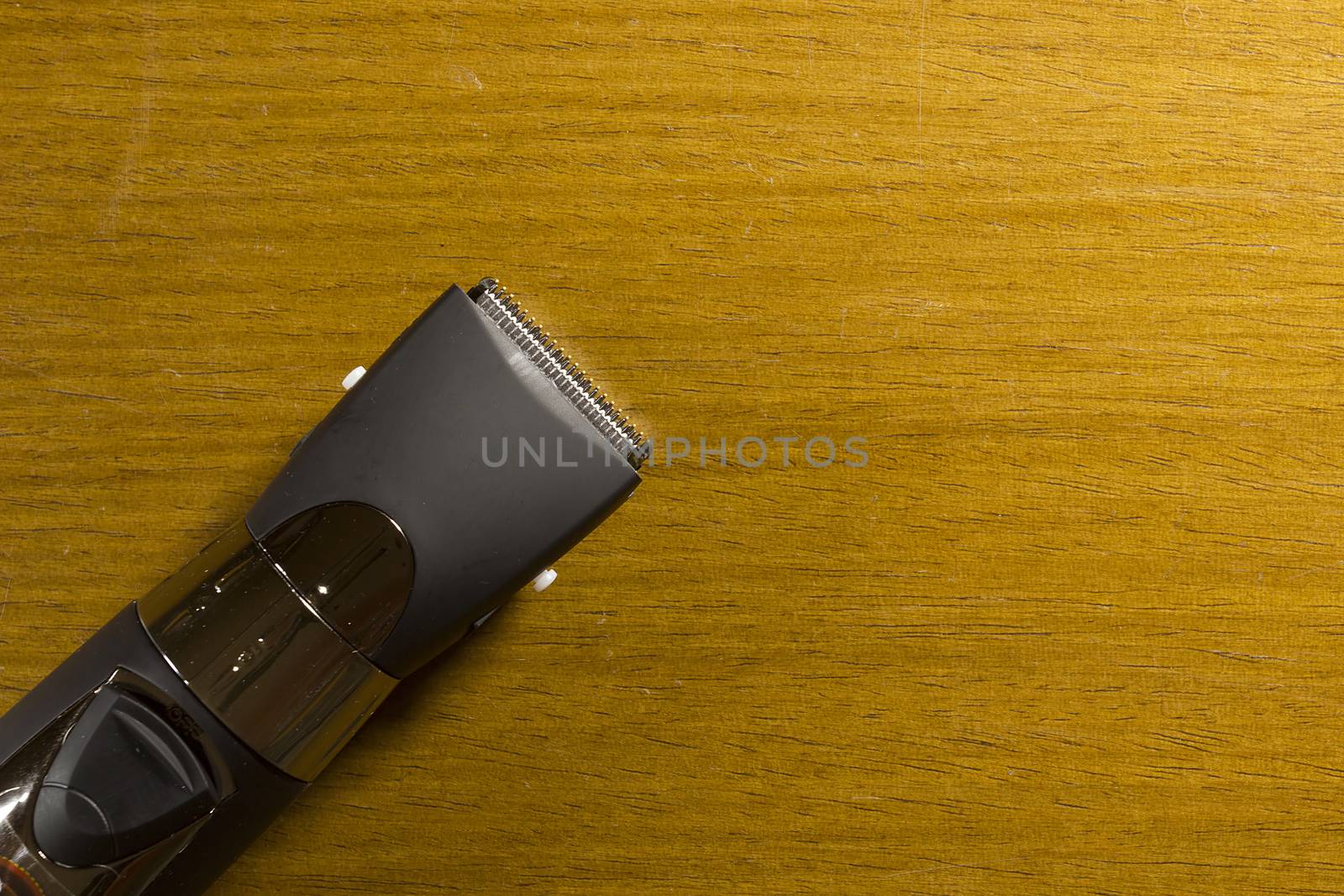 Hair clipper style on the wooden background